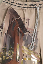Print-Hose mit Italien-Motiv und Goldakzenten