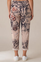 Print-Hose mit Porträt- und Rosenmotiv